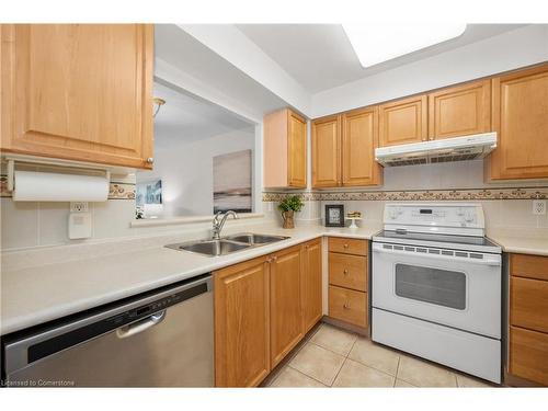 1214-100 Burloak Drive, Burlington, ON - Indoor Photo Showing Kitchen With Double Sink