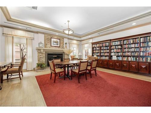 1214-100 Burloak Drive, Burlington, ON - Indoor Photo Showing Dining Room With Fireplace