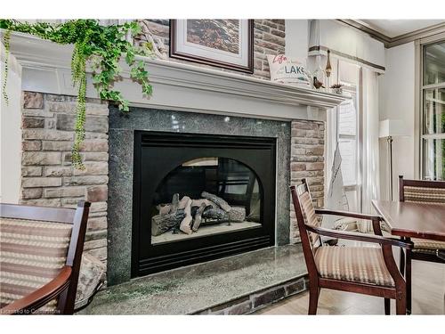 1214-100 Burloak Drive, Burlington, ON - Indoor Photo Showing Living Room With Fireplace