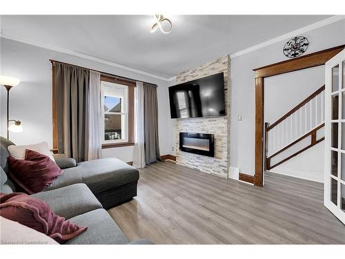 53 1/2 Robins Avenue, Hamilton, ON - Indoor Photo Showing Living Room With Fireplace