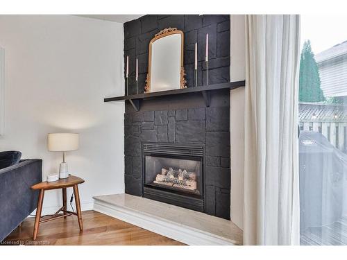 110-3333 New Street, Burlington, ON - Indoor Photo Showing Living Room With Fireplace