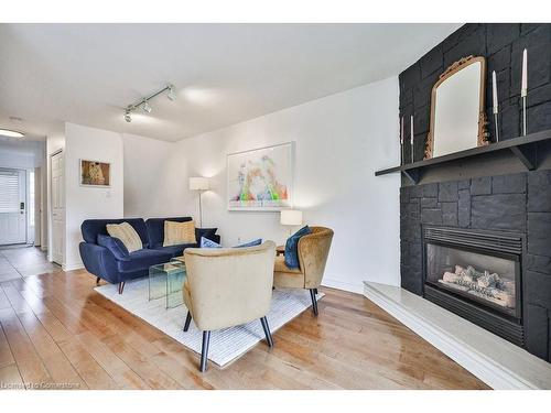 110-3333 New Street, Burlington, ON - Indoor Photo Showing Living Room With Fireplace