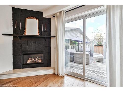 110-3333 New Street, Burlington, ON - Indoor Photo Showing Living Room With Fireplace