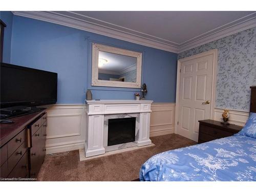 888 Mckenzie Road, Oneida, ON - Indoor Photo Showing Bedroom With Fireplace