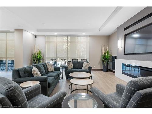 2012-335 Rathburn Road W, Peel, ON - Indoor Photo Showing Living Room With Fireplace