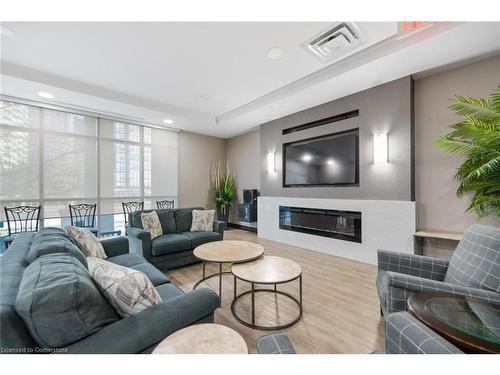 2012-335 Rathburn Road W, Peel, ON - Indoor Photo Showing Living Room With Fireplace