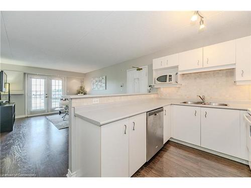 310-1800 Walkers Line, Burlington, ON - Indoor Photo Showing Kitchen With Double Sink