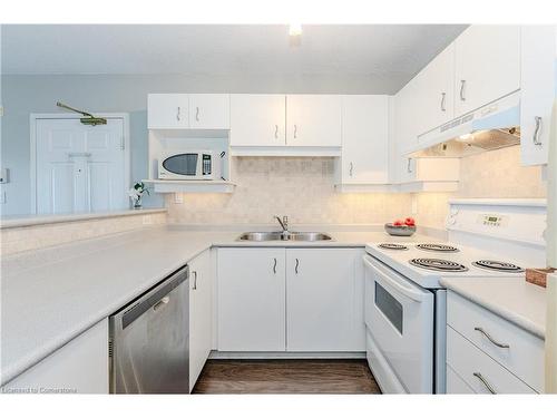 310-1800 Walkers Line, Burlington, ON - Indoor Photo Showing Kitchen With Double Sink