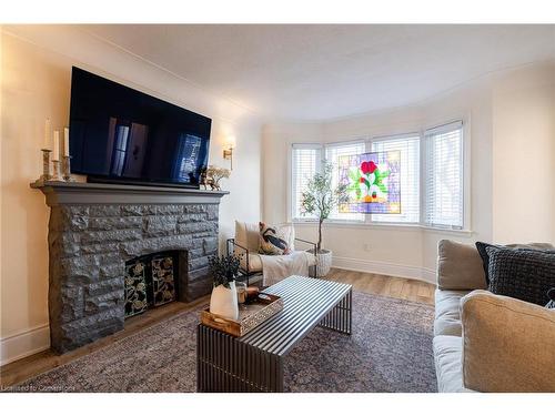 182 Huxley Avenue S, Hamilton, ON - Indoor Photo Showing Living Room With Fireplace