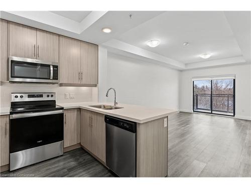 503-30 Hamilton Street S, Waterdown, ON - Indoor Photo Showing Kitchen With Double Sink