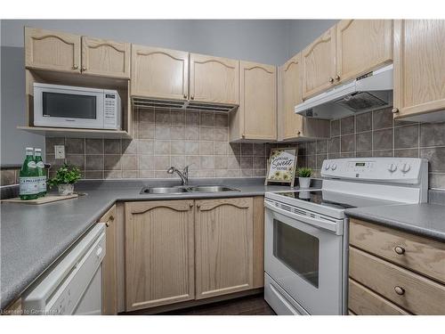 404-4015 Kilmer Drive, Burlington, ON - Indoor Photo Showing Kitchen With Double Sink