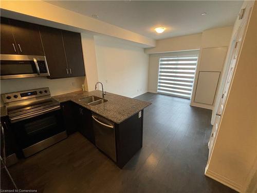 103-128 Grovewood Common, Oakville, ON - Indoor Photo Showing Kitchen With Double Sink