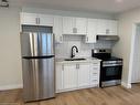 15-1759 King Street E, Hamilton, ON  - Indoor Photo Showing Kitchen With Stainless Steel Kitchen With Double Sink 