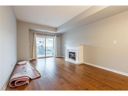 207-4000 Creekside Drive, Dundas, ON - Indoor With Fireplace