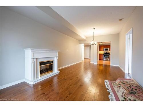 207-4000 Creekside Drive, Dundas, ON - Indoor Photo Showing Living Room With Fireplace