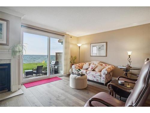 27-515 North Service Road, Stoney Creek, ON - Indoor Photo Showing Living Room With Fireplace