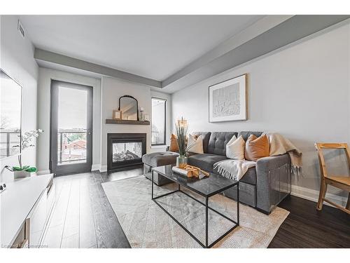 402-181 James Street N, Hamilton, ON - Indoor Photo Showing Living Room With Fireplace