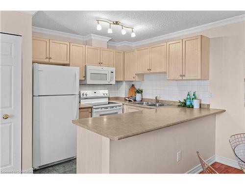 205-4140 Foxwood Drive, Burlington, ON - Indoor Photo Showing Kitchen With Double Sink