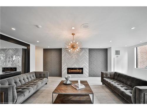 705-1270 Maple Crossing Boulevard, Burlington, ON - Indoor Photo Showing Living Room With Fireplace