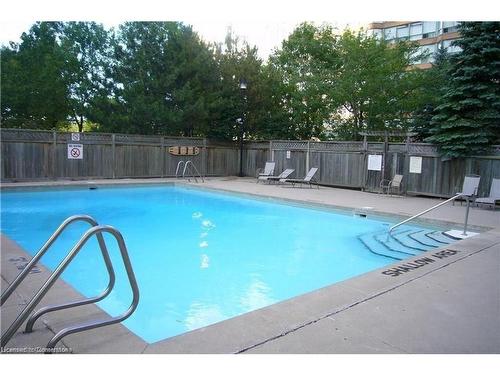 705-1270 Maple Crossing Boulevard, Burlington, ON - Outdoor With In Ground Pool With Backyard