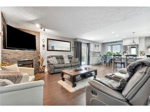 100 Stone Church Road E, Hamilton, ON - Indoor Photo Showing Living Room With Fireplace