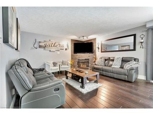 100 Stone Church Road E, Hamilton, ON - Indoor Photo Showing Living Room With Fireplace