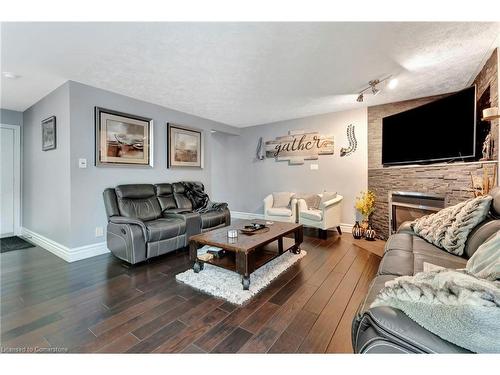 100 Stone Church Road E, Hamilton, ON - Indoor Photo Showing Living Room With Fireplace