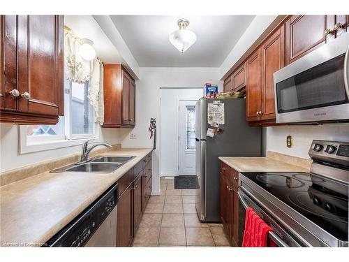 97 Guildwood Drive, Hamilton, ON - Indoor Photo Showing Kitchen With Double Sink