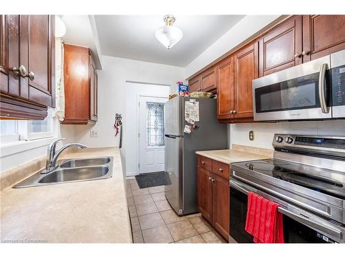 97 Guildwood Drive, Hamilton, ON - Indoor Photo Showing Kitchen With Double Sink