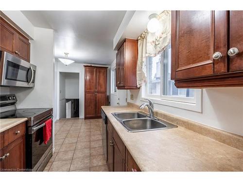 97 Guildwood Drive, Hamilton, ON - Indoor Photo Showing Kitchen With Double Sink