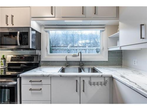 312 Wexford Avenue S, Hamilton, ON - Indoor Photo Showing Kitchen With Double Sink