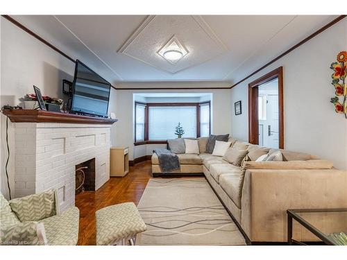 312 Wexford Avenue S, Hamilton, ON - Indoor Photo Showing Living Room With Fireplace