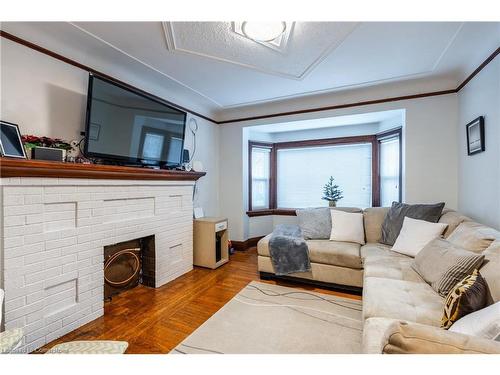 312 Wexford Avenue S, Hamilton, ON - Indoor Photo Showing Living Room With Fireplace