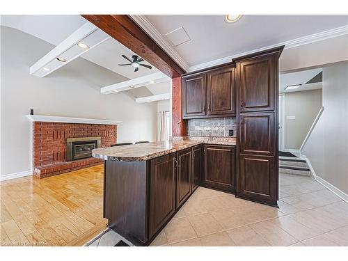 386 West 5Th Street, Hamilton, ON - Indoor Photo Showing Kitchen With Fireplace