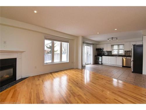 53 Dulgaren Street, Hamilton, ON - Indoor Photo Showing Living Room With Fireplace