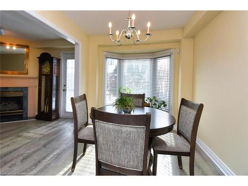 151 Dicenzo Drive, Hamilton, ON - Indoor Photo Showing Dining Room With Fireplace