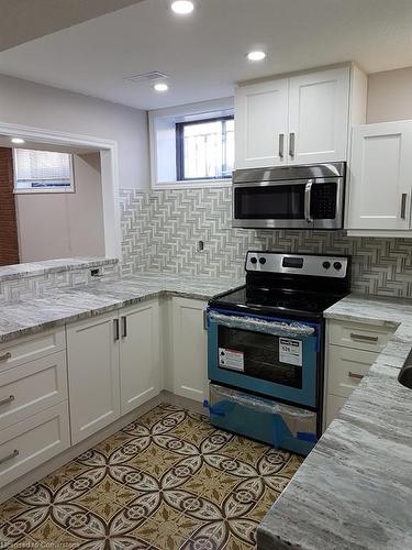 412 Quigley Road, Hamilton, ON - Indoor Photo Showing Kitchen With Upgraded Kitchen