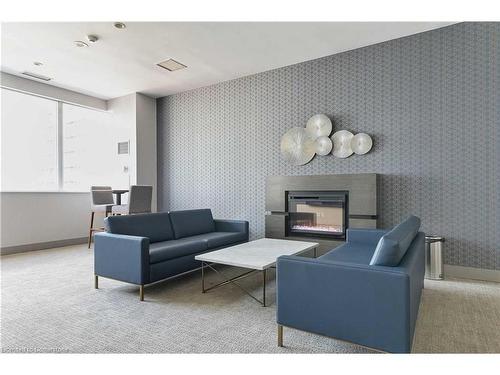 409-270 Wellington Street W, Toronto, ON - Indoor Photo Showing Living Room With Fireplace