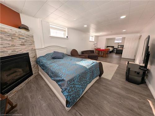 208 West 19Th Street, Hamilton, ON - Indoor Photo Showing Bedroom With Fireplace