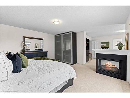 2112 Berwick Drive, Burlington, ON - Indoor Photo Showing Bedroom With Fireplace