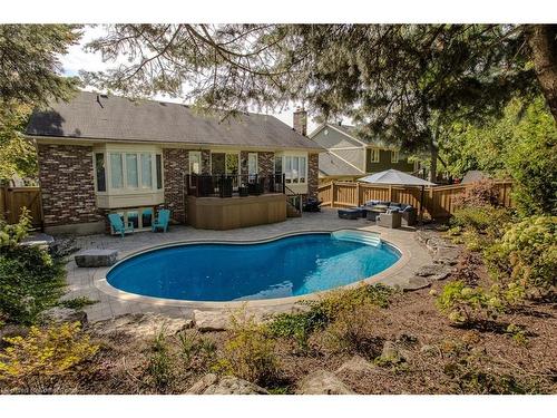 2031 Foster Court, Burlington, ON - Outdoor With In Ground Pool With Deck Patio Veranda With Backyard