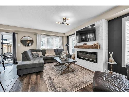 64 Arnold Marshall Boulevard, Caledonia, ON - Indoor Photo Showing Living Room With Fireplace