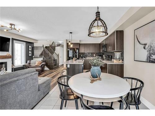 64 Arnold Marshall Boulevard, Caledonia, ON - Indoor Photo Showing Dining Room With Fireplace