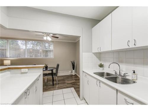 104-2052 Courtland Drive, Burlington, ON - Indoor Photo Showing Kitchen With Double Sink