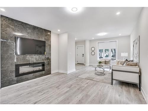 221 Rosslyn Avenue N, Hamilton, ON - Indoor Photo Showing Living Room With Fireplace