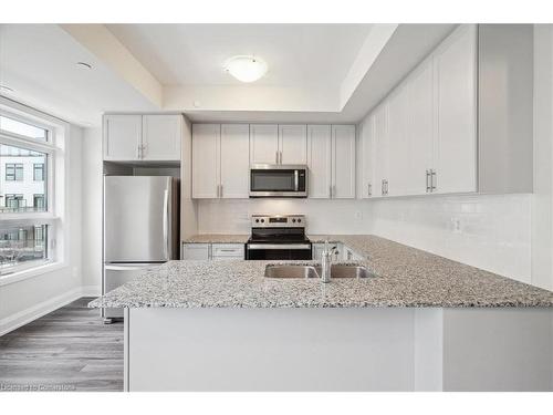 105-1593 Rose Way, Milton, ON - Indoor Photo Showing Kitchen With Double Sink With Upgraded Kitchen