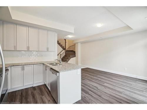 105-1593 Rose Way, Milton, ON - Indoor Photo Showing Kitchen With Double Sink