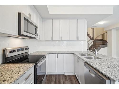 105-1593 Rose Way, Milton, ON - Indoor Photo Showing Kitchen With Double Sink With Upgraded Kitchen