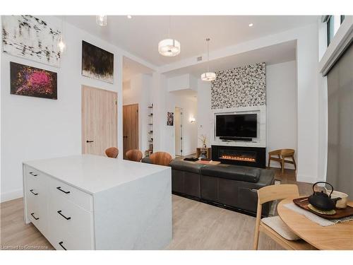 Lph13-118 King Street E, Hamilton, ON - Indoor Photo Showing Living Room With Fireplace