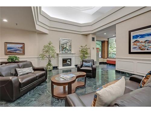 Ph105-1271 Walden Circle, Mississauga, ON - Indoor Photo Showing Living Room With Fireplace